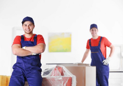 Man with van loading household furniture in Croydon