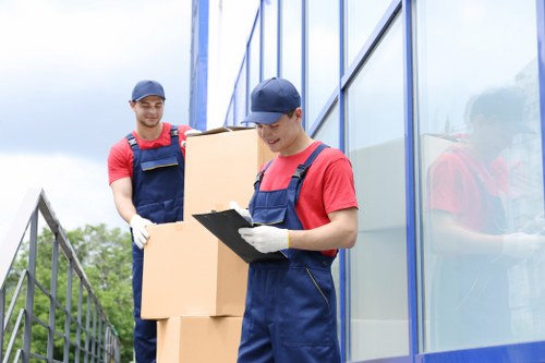 Removal team planning a safe move with equipment and boxes