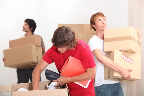 Professional movers loading furniture for a Croydon house move