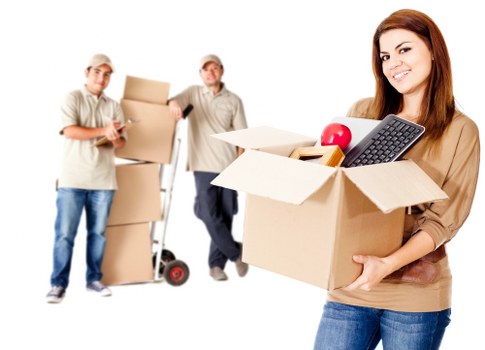 Removal crew handling office furniture in a Croydon workspace