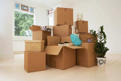 Movers securing furniture safely inside a removal vehicle