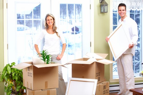 Professional movers handling furniture with care and protection